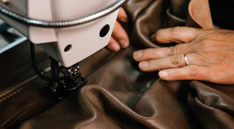 Craftsmaftsman sewing leather
